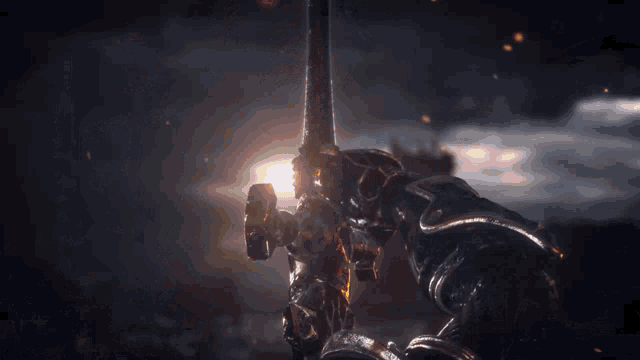 a person standing in a field with a sword in their hand surrounded by fire