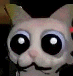 a stuffed animal with big eyes and a mustache is looking at the camera .
