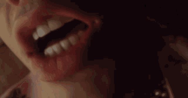 a close up of a woman 's lips with pink lipstick