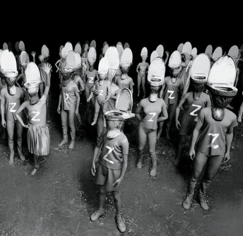 a group of people wearing toilet seats on their heads with the letter z on them