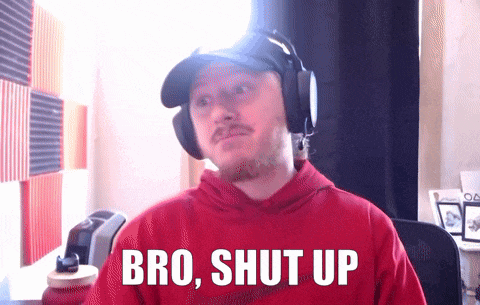 a man wearing headphones and a red sweatshirt says bro shut up