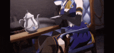 a woman in a blue dress is sitting in a chair holding a teapot