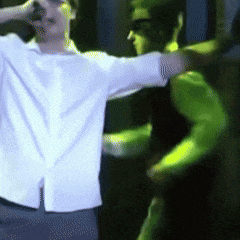 a blurry picture of a man in a white shirt
