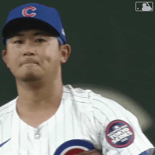 a baseball player wearing a blue hat with a c on it