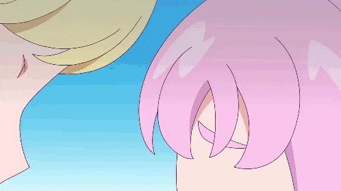 a close up of a girl 's face with pink hair