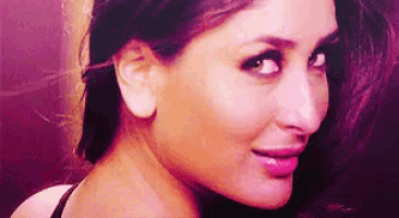 a close up of a woman 's face with a pink lip and a purple background .