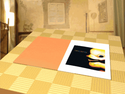 a picture of a duck is on a table with a checkered tablecloth