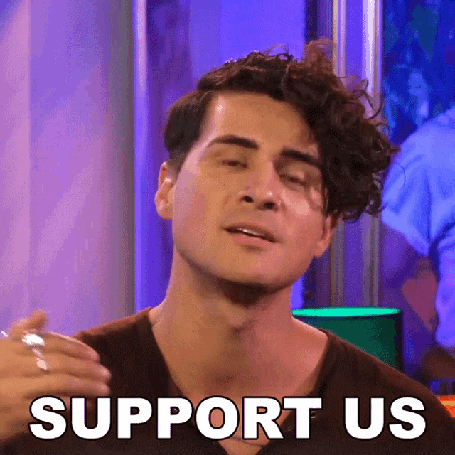 a man with a ring on his finger is making a support us gesture
