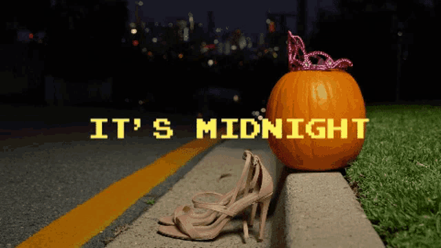a pumpkin with the words it 's midnight on the side of it