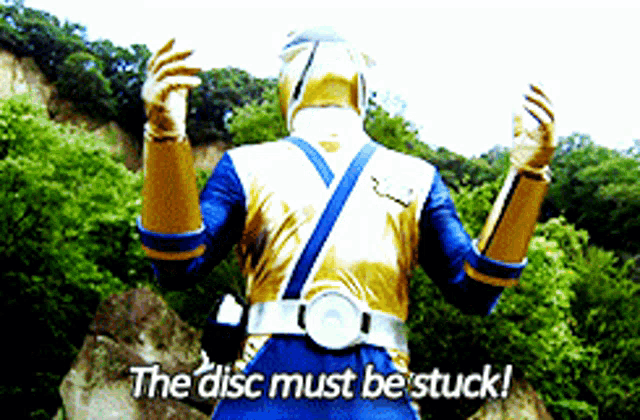 a man in a superhero costume says " the disc must be stuck ! "