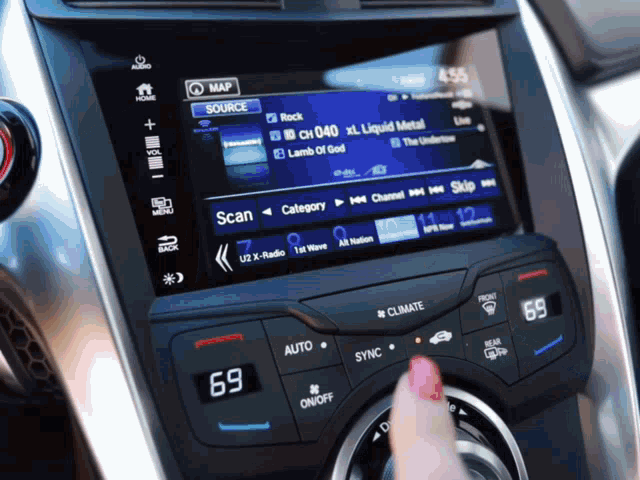 a person is adjusting the air conditioning in a car