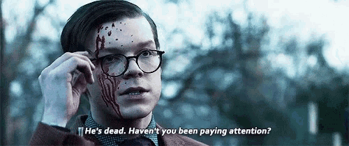 a man with blood on his face and glasses says he 's dead haven 't you been paying attention