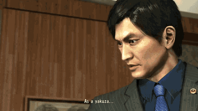 a man in a suit and tie is talking about being a yakuza