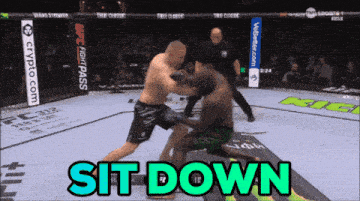 two men are fighting in a boxing ring and the words sit down are visible