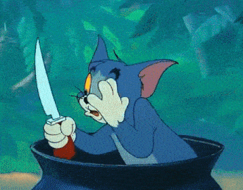 tom from tom and jerry is holding a knife in a pot