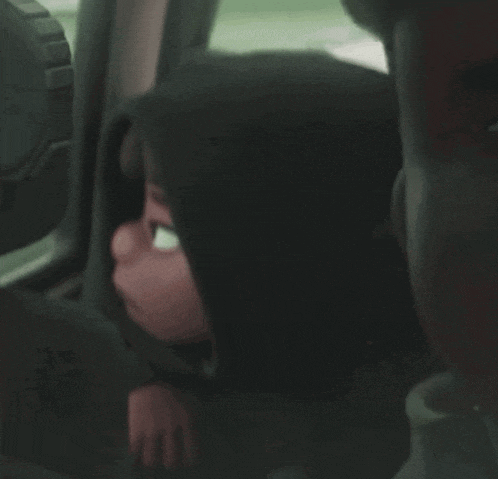 a cartoon character wearing a hooded sweatshirt is making a funny face