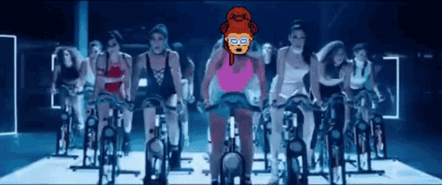 a group of women are riding exercise bikes in a gym with a pixel art of a woman wearing glasses