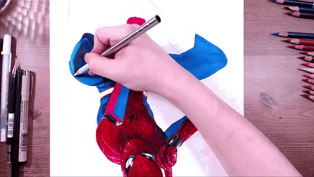 a person is drawing a picture of spider man