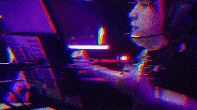 a man wearing headphones and a microphone is playing a video game