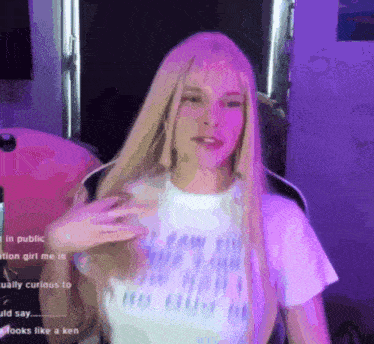 a woman with long blonde hair is wearing a white t-shirt that says " i saw the light " on it