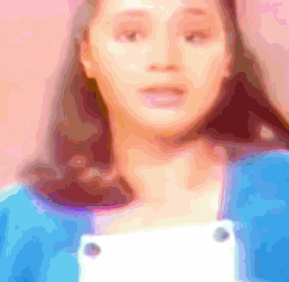 a blurry picture of a woman 's face with a pink background