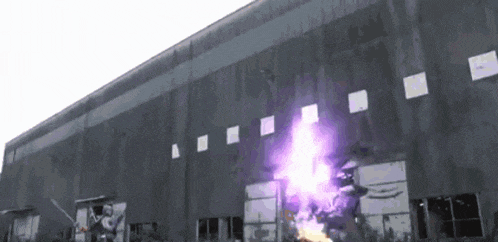 a purple light is coming out of the side of a building
