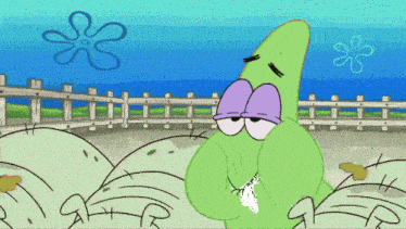 a green cartoon character with purple eyes and a purple nose