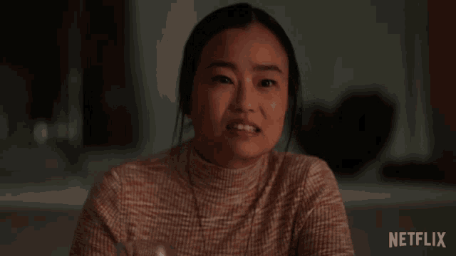 a woman is making a funny face and the word kidding is on the screen