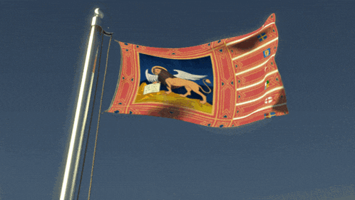 a flag with a lion on it and the letter u on it