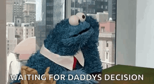cookie monster from sesame street is sitting in front of a window waiting for daddy 's decision