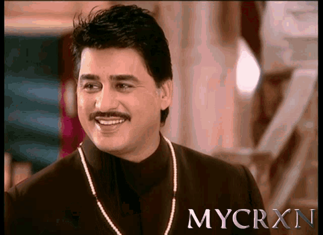 a man with a mustache and a pearl necklace is smiling in a mycrxn advertisement