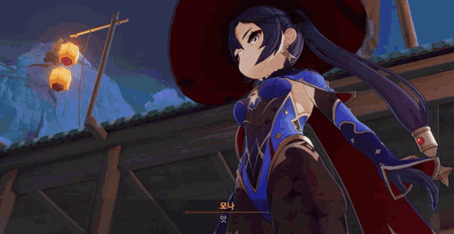 a girl in a witch costume has chinese writing on her chest