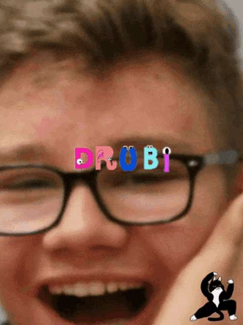 a close up of a person 's face with the word drubi written on it
