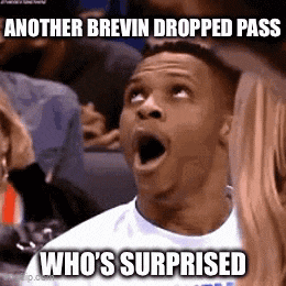 a man with his mouth open and the words another brewin dropped pass who 's surprised
