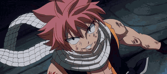 a cartoon character with red hair and a scarf around his neck has a tattoo on his arm