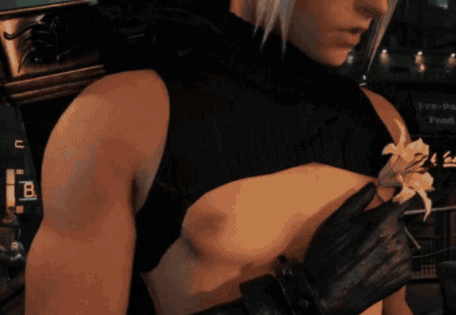 a man 's chest is shown in a video game with the letter b visible in the background
