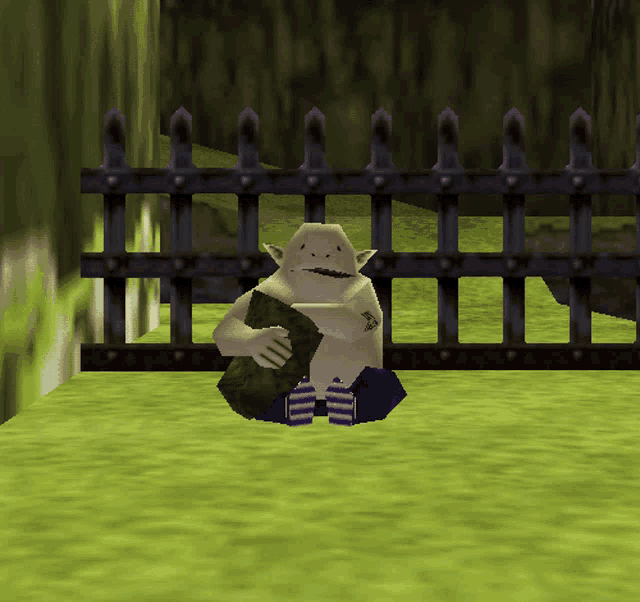 a video game character is sitting in front of a fence holding a rock