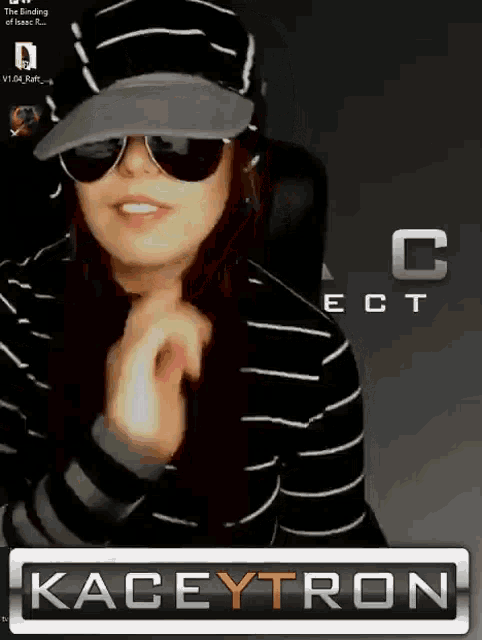 a woman wearing sunglasses and a hat is standing in front of a kaceytron sign