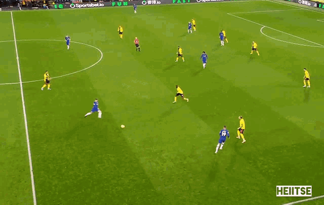 soccer players on a field with a sportsbet.io banner
