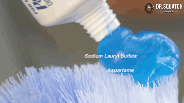 a bottle of sodium lauryl sulfate is being poured on a brush