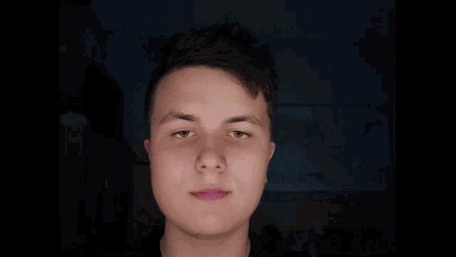 a close up of a man 's face with a circle in the middle of it