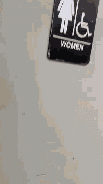a blurry picture of a person standing in a hallway