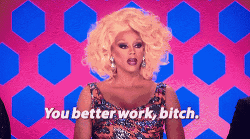 a drag queen is standing in front of a pink and blue background and saying `` you better work , bitch '' .