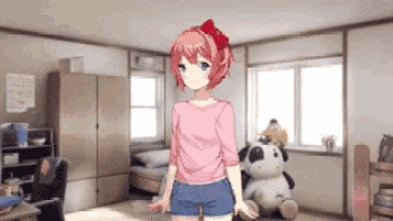 a girl in a pink shirt and shorts is standing in a room with stuffed animals