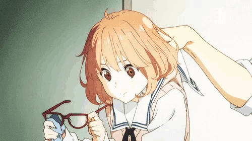 a girl in a sailor suit is holding a pair of glasses in her hand .