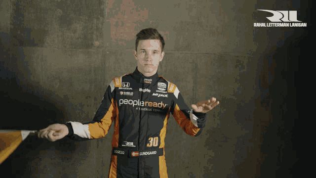 a man in a racing suit that says peopleready