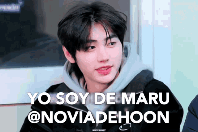 a young man in a hoodie says yo soy de maru