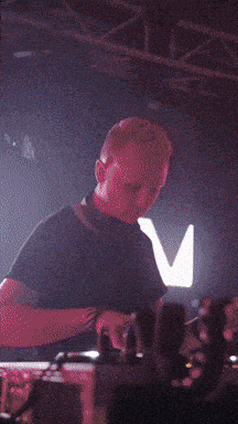 a blurry photo of a man playing a musical instrument
