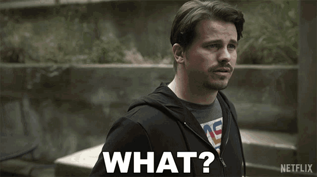 a man in a black hoodie says what