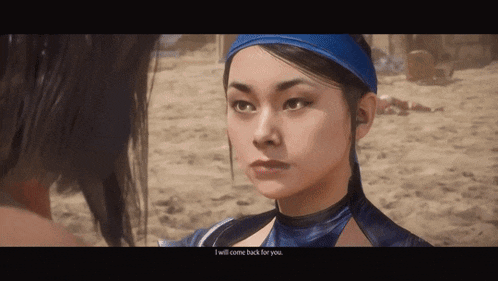 a woman in a blue outfit is talking to another woman on a beach .